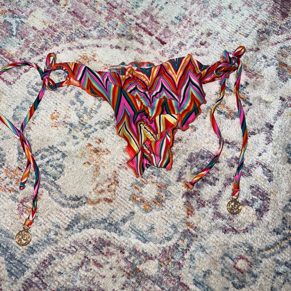 Luli Fama size small string bikini cheeky bottom